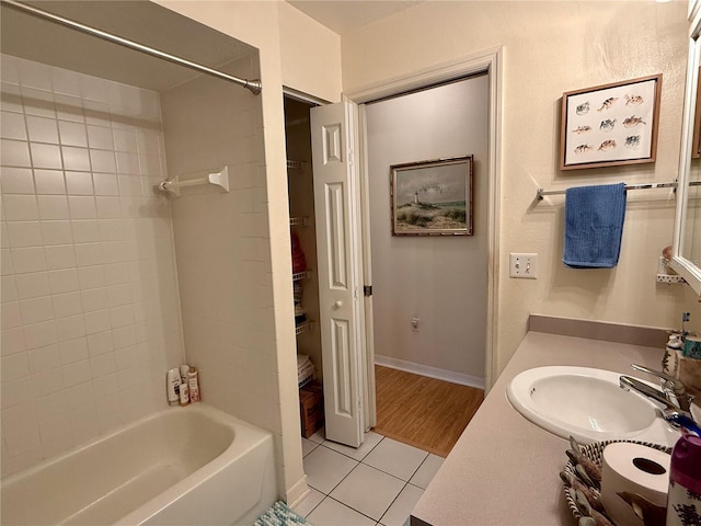 3828 6th Ave W, Palmetto, FL 34221 - full bathroom featuring tile patterned flooring, vanity, washtub / shower combination, and baseboards