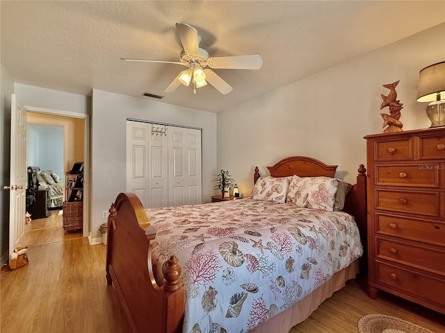 3828 6th Ave W, Palmetto, FL 34221 - bedroom featuring light wood-style floors, a closet, and ceiling fan