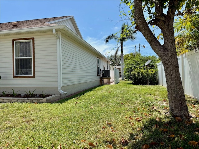 3828 6th Ave W, Palmetto, FL 34221 - view of side of home with central AC and roof with shingles
