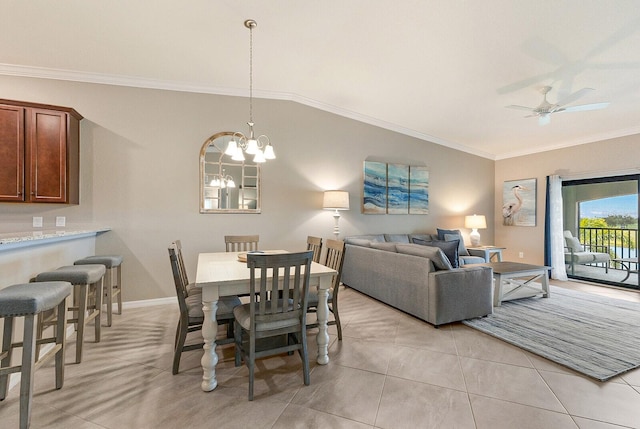 5624 Palmer Cir Unit 206, Bradenton, FL 34211 - dining area featuring crown molding, a chandelier, a ceiling fan, light tile patterned floors, and lofted ceiling