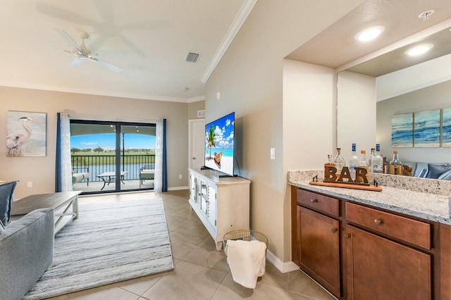 5624 Palmer Cir Unit 206, Bradenton, FL 34211 - bathroom featuring vanity, tile patterned flooring, ornamental molding, and a ceiling fan