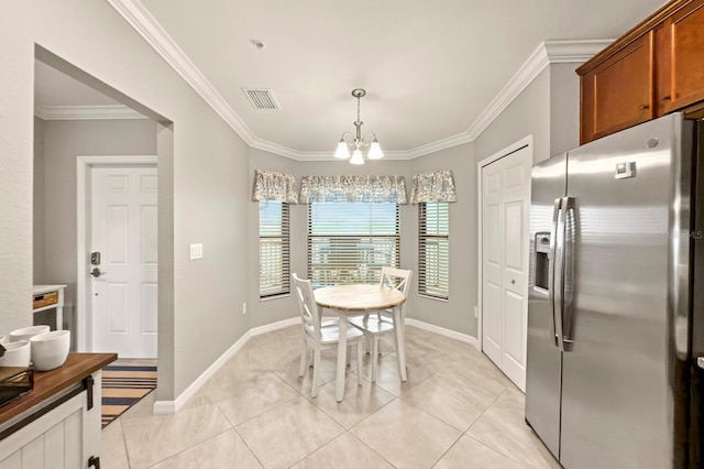 5624 Palmer Cir Unit 206, Bradenton, FL 34211 - dining area with a chandelier, crown molding, and light tile patterned flooring