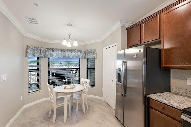 5624 Palmer Cir Unit 206, Bradenton, FL 34211 - kitchen featuring stainless steel fridge, a chandelier, crown molding, light tile patterned flooring, and decorative light fixtures