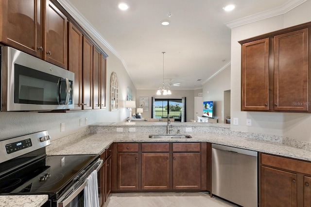 5624 Palmer Cir Unit 206, Bradenton, FL 34211 - kitchen featuring stainless steel appliances, ornamental molding, light stone counters, recessed lighting, and light tile patterned floors