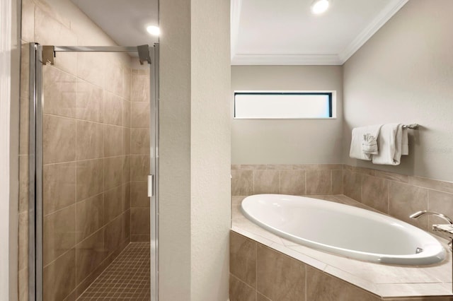 5624 Palmer Cir Unit 206, Bradenton, FL 34211 - bathroom featuring a garden tub, a shower stall, and crown molding