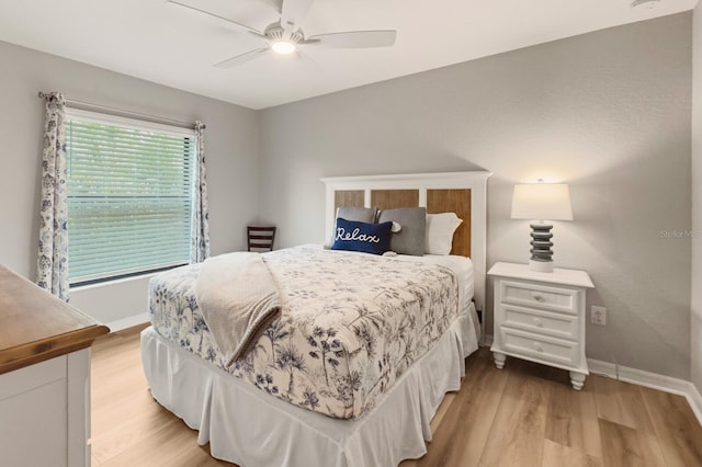 5624 Palmer Cir Unit 206, Bradenton, FL 34211 - bedroom with light wood-type flooring and a ceiling fan