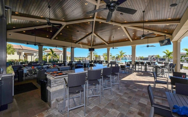 5624 Palmer Cir Unit 206, Bradenton, FL 34211 - view of patio featuring ceiling fan and a bar