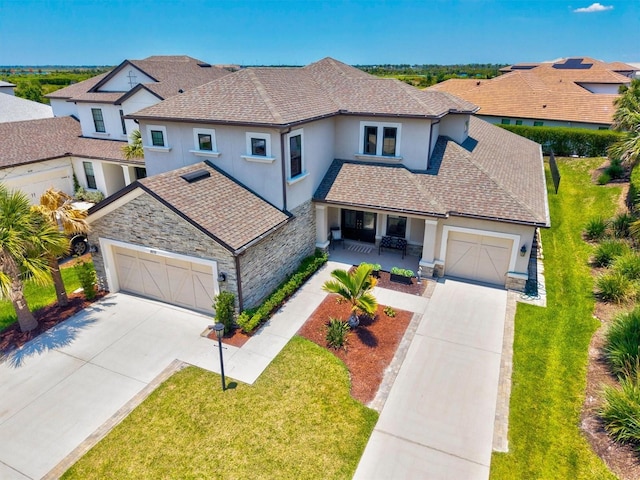 8272 Summer Night Rd, Sarasota, FL 34241 - view of front of property with driveway, stucco siding, a porch, and a garage