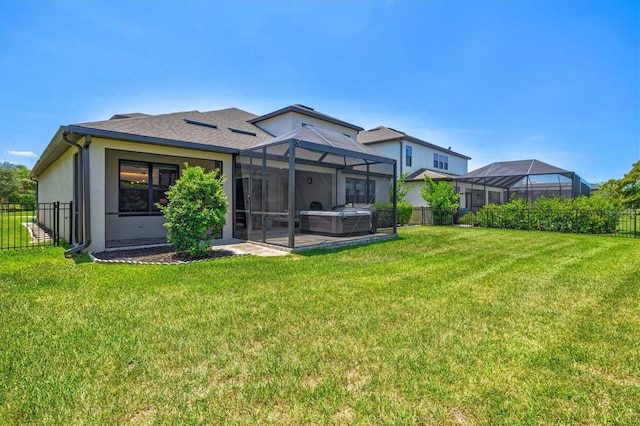 8272 Summer Night Rd, Sarasota, FL 34241 - rear view of house featuring a hot tub, a patio, and roof with shingles