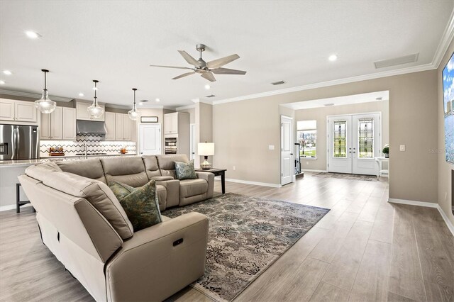 8272 Summer Night Rd, Sarasota, FL 34241 - living area featuring a ceiling fan, baseboards, light wood-style flooring, crown molding, and recessed lighting