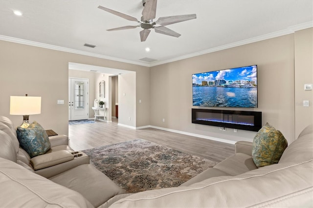 8272 Summer Night Rd, Sarasota, FL 34241 - living room featuring wood finished floors, ornamental molding, ceiling fan, baseboards, and recessed lighting
