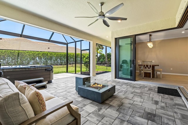 8272 Summer Night Rd, Sarasota, FL 34241 - view of patio with a hot tub, ceiling fan, a lanai, and an outdoor living space with a fire pit