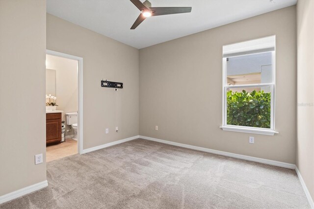 8272 Summer Night Rd, Sarasota, FL 34241 - spare room featuring light carpet, a ceiling fan, and baseboards