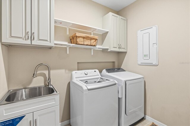 8272 Summer Night Rd, Sarasota, FL 34241 - laundry area featuring cabinet space, separate washer and dryer, electric panel, and baseboards