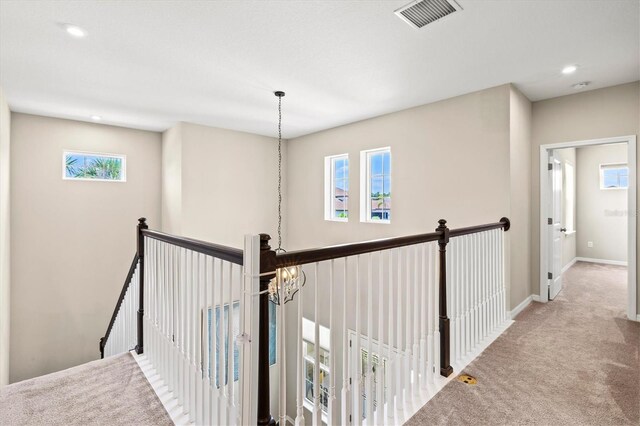 8272 Summer Night Rd, Sarasota, FL 34241 - corridor featuring an upstairs landing, carpet, plenty of natural light, baseboards, and recessed lighting