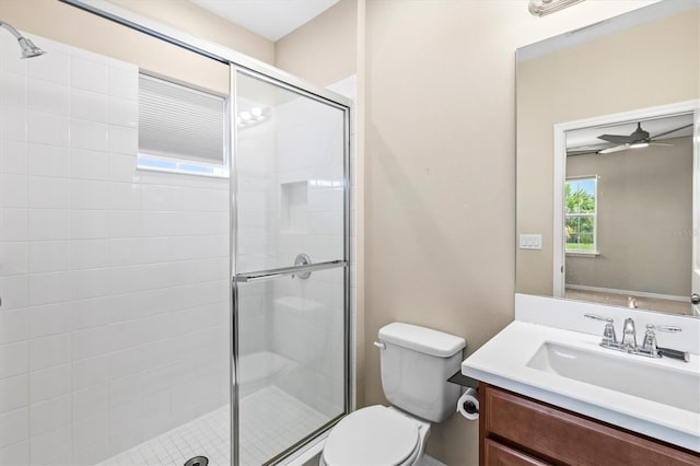 8272 Summer Night Rd, Sarasota, FL 34241 - bathroom with toilet, vanity, a stall shower, and a ceiling fan