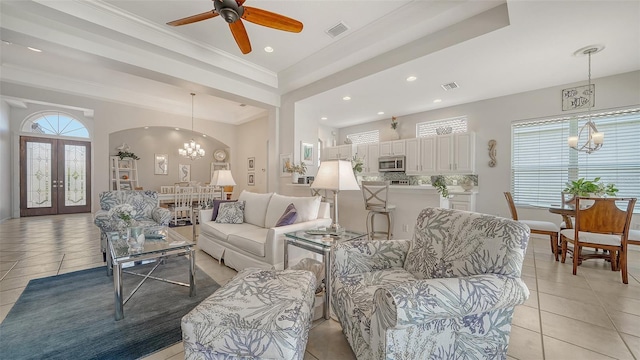 4220 Miriana Way, Sarasota, FL 34233 - living room featuring a chandelier, recessed lighting, light tile patterned floors, ceiling fan, and crown molding