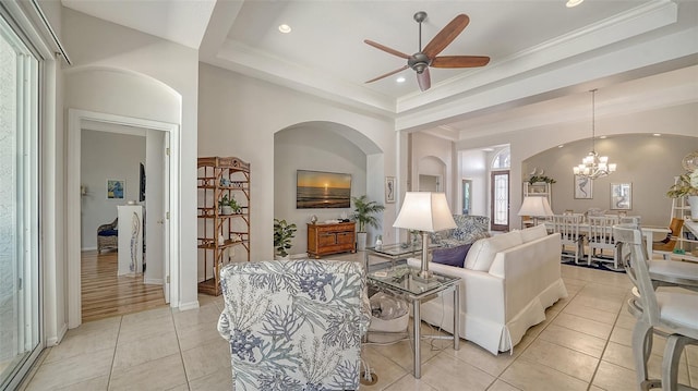 4220 Miriana Way, Sarasota, FL 34233 - living area featuring light tile patterned floors, a raised ceiling, ceiling fan, a chandelier, and recessed lighting