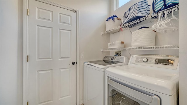 4220 Miriana Way, Sarasota, FL 34233 - laundry area with washing machine and clothes dryer