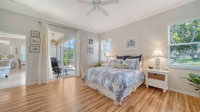 4220 Miriana Way, Sarasota, FL 34233 - bedroom with access to exterior, multiple windows, light wood-style floors, and ornamental molding