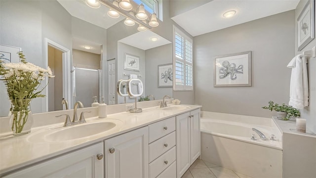 4220 Miriana Way, Sarasota, FL 34233 - bathroom featuring a shower stall, double vanity, a bath, and tile patterned floors