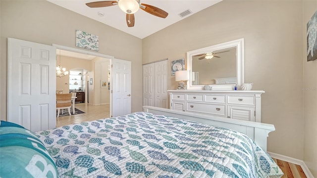 4220 Miriana Way, Sarasota, FL 34233 - bedroom with baseboards, a closet, a ceiling fan, and arched walkways