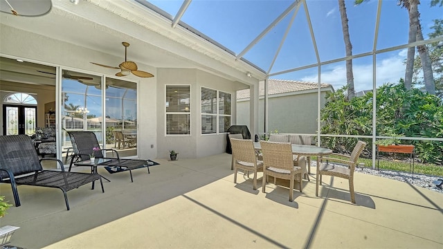 4220 Miriana Way, Sarasota, FL 34233 - view of patio / terrace featuring ceiling fan, a lanai, and outdoor dining space