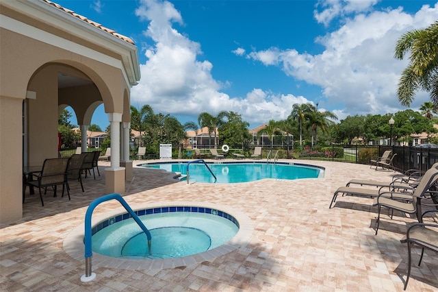 4220 Miriana Way, Sarasota, FL 34233 - community pool with a hot tub and a patio area