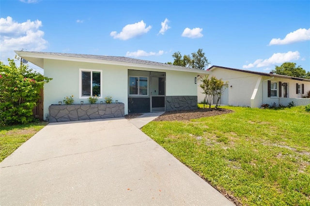 1040 Hope St, Venice, FL 34285 - ranch-style home featuring stucco siding and a front lawn