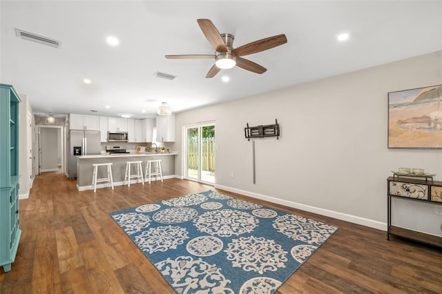 1040 Hope St, Venice, FL 34285 - living room with ceiling fan, dark wood-type flooring, baseboards, and recessed lighting