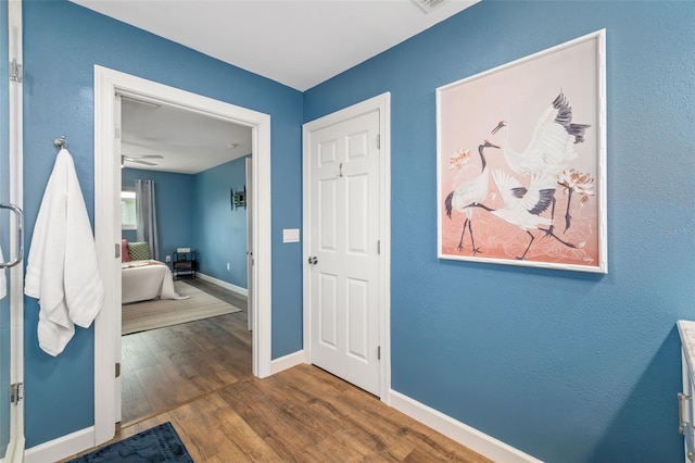 1040 Hope St, Venice, FL 34285 - foyer featuring baseboards and dark wood-style floors