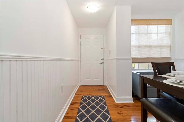 5401 Bentgrass Dr Unit 1-113, Sarasota, FL 34235 - entryway featuring light wood finished floors and a wainscoted wall