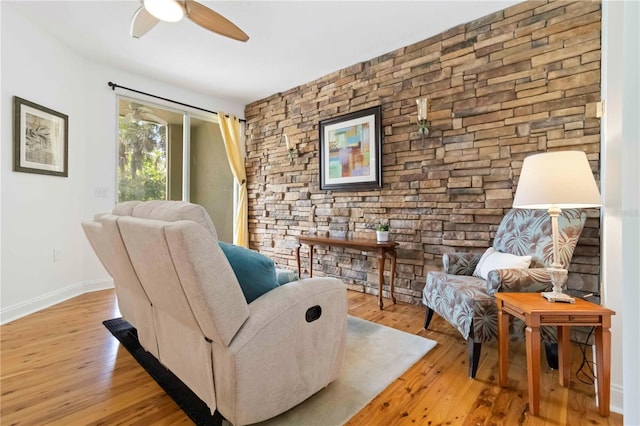 5401 Bentgrass Dr Unit 1-113, Sarasota, FL 34235 - living area with wood-type flooring, ceiling fan, and baseboards