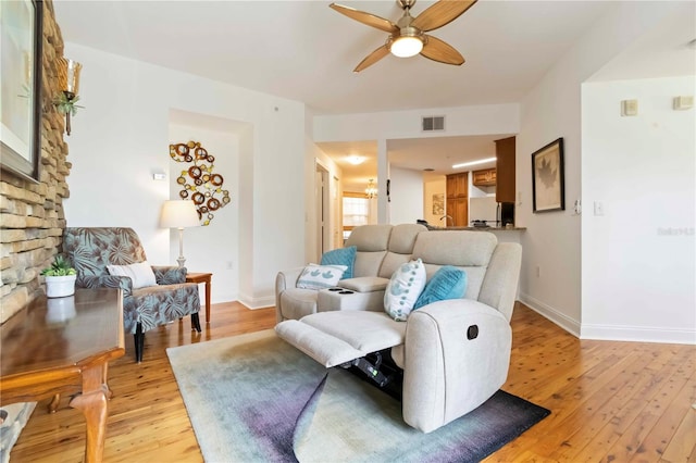 5401 Bentgrass Dr Unit 1-113, Sarasota, FL 34235 - living area featuring ceiling fan, light wood finished floors, and baseboards