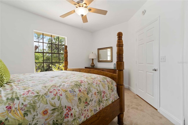 5401 Bentgrass Dr Unit 1-113, Sarasota, FL 34235 - bedroom with light colored carpet, baseboards, and ceiling fan