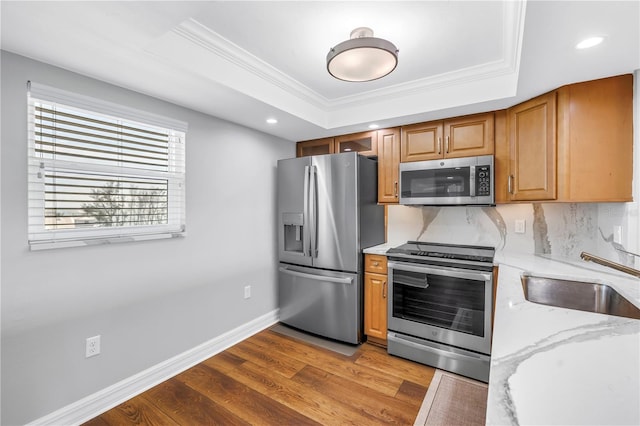 9393 Midnight Pass Rd Unit 603, Sarasota, FL 34242 - kitchen featuring appliances with stainless steel finishes, crown molding, a sink, wood finished floors, and recessed lighting