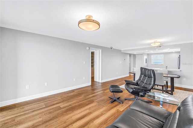 9393 Midnight Pass Rd Unit 603, Sarasota, FL 34242 - living area with ornamental molding, wood finished floors, and baseboards