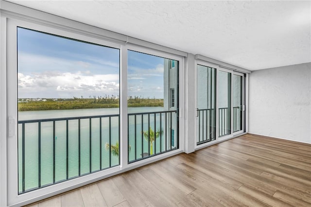 9393 Midnight Pass Rd Unit 603, Sarasota, FL 34242 - unfurnished sunroom with a water view
