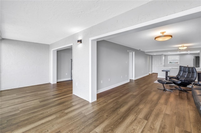 9393 Midnight Pass Rd Unit 603, Sarasota, FL 34242 - living area featuring wood finished floors, a textured ceiling, and a textured wall