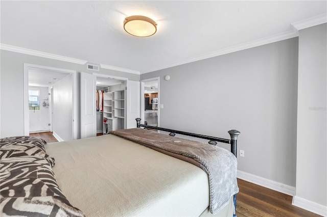 9393 Midnight Pass Rd Unit 603, Sarasota, FL 34242 - bedroom featuring dark wood finished floors, crown molding, baseboards, a spacious closet, and a closet