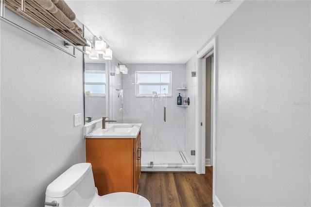 9393 Midnight Pass Rd Unit 603, Sarasota, FL 34242 - full bathroom featuring a stall shower, vanity, toilet, and wood finished floors