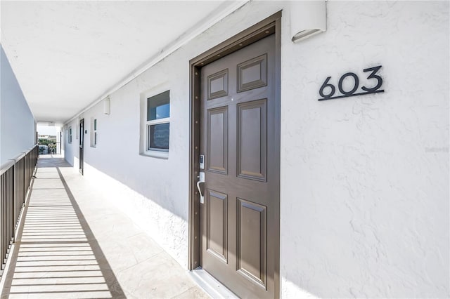 9393 Midnight Pass Rd Unit 603, Sarasota, FL 34242 - doorway to property featuring stucco siding
