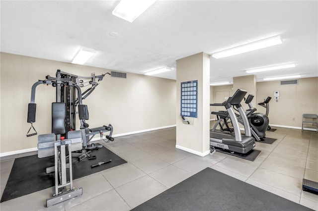 9393 Midnight Pass Rd Unit 603, Sarasota, FL 34242 - exercise area with baseboards, tile patterned floors, and a textured ceiling