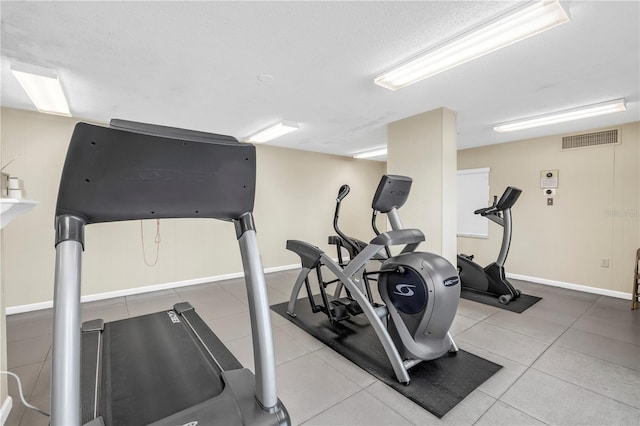 9393 Midnight Pass Rd Unit 603, Sarasota, FL 34242 - workout area featuring baseboards