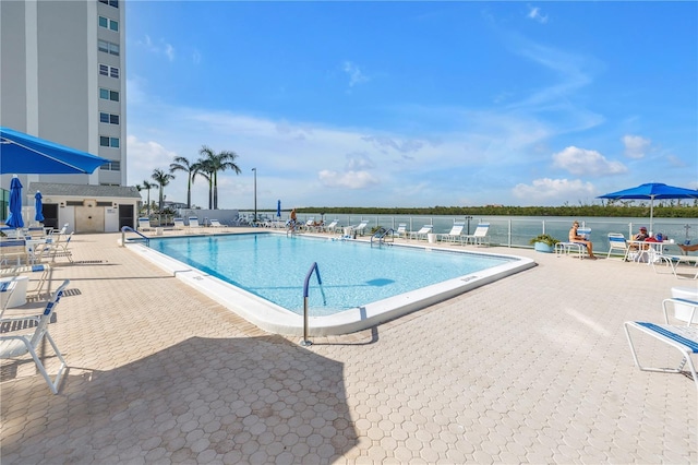 9393 Midnight Pass Rd Unit 603, Sarasota, FL 34242 - community pool with a patio area
