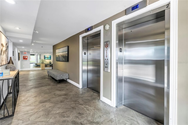 9393 Midnight Pass Rd Unit 603, Sarasota, FL 34242 - hallway with elevator, baseboards, and recessed lighting