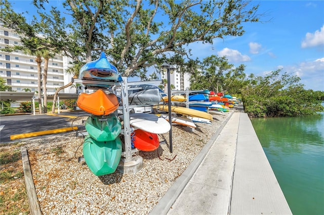 9393 Midnight Pass Rd Unit 603, Sarasota, FL 34242 - view of play area with a water view and a boat dock