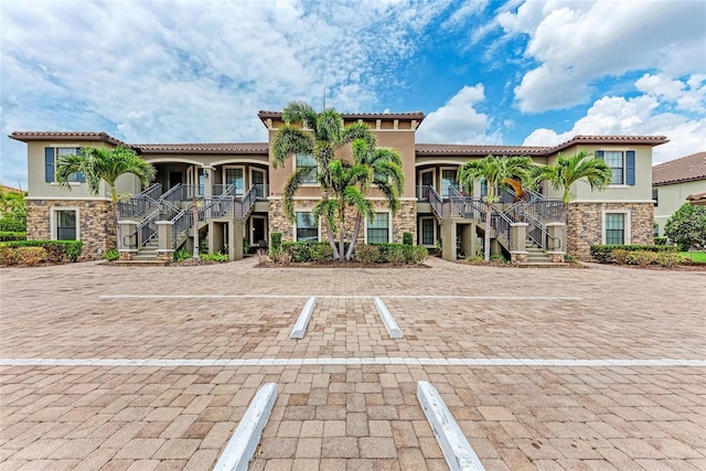 13711 Messina Loop Unit 102, Lakewood Ranch, FL 34211 - view of building exterior with stairway and uncovered parking