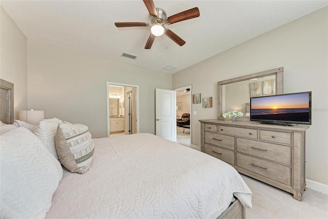13711 Messina Loop Unit 102, Lakewood Ranch, FL 34211 - bedroom with light colored carpet, ensuite bathroom, ceiling fan, and baseboards