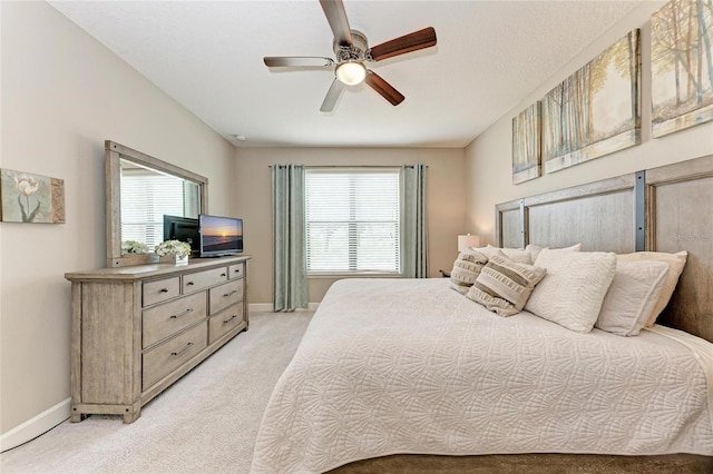 13711 Messina Loop Unit 102, Lakewood Ranch, FL 34211 - bedroom with light carpet, baseboards, and ceiling fan
